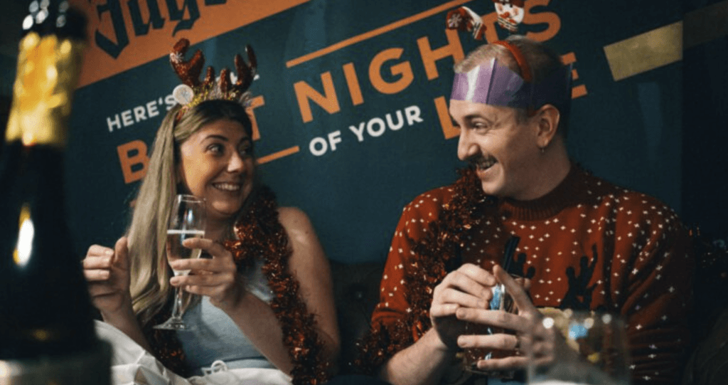 Dean in a Christmas jumper and paper crown at a festive photoshoot, shot in the middle of summer
