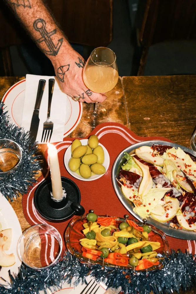 A festive table with candles and sharing plates