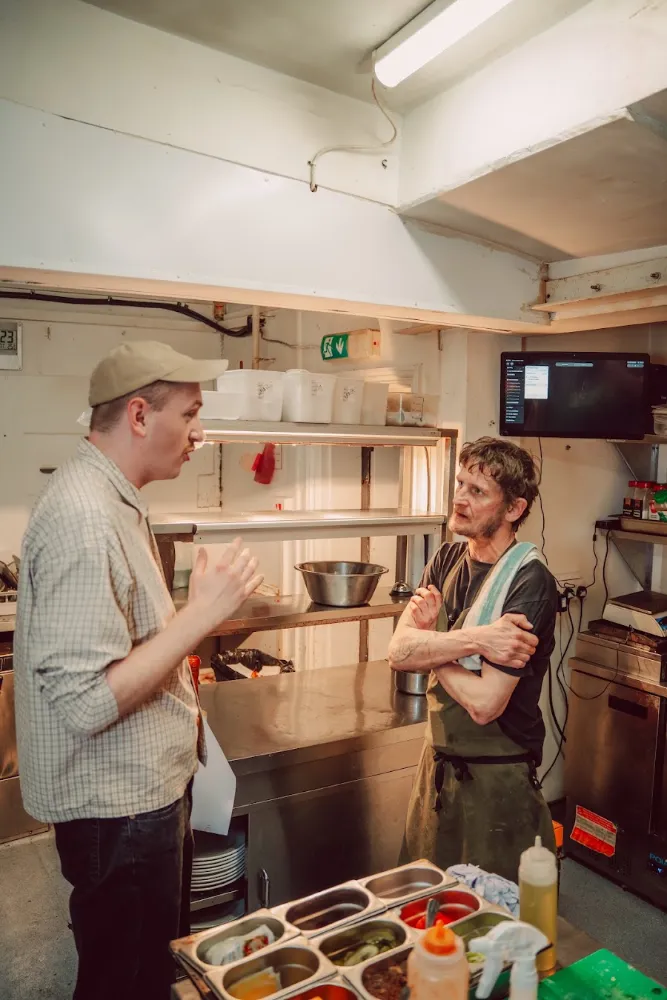 A kitchen team at work on the pass