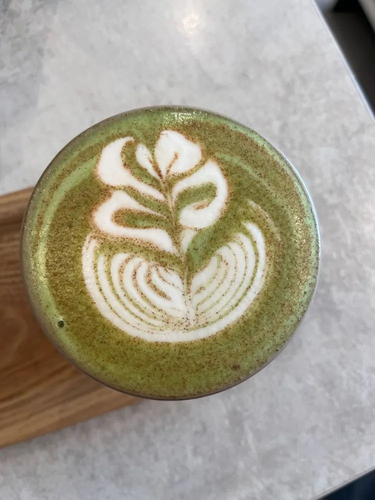 A matcha latte with leaf latte art